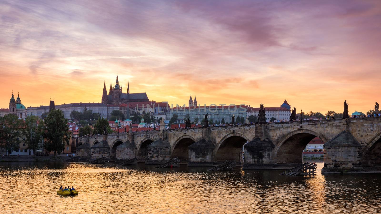 Charles Bridge at sunset with colorful sky, Prague, Czech Republic. Prague old town and iconic Charles bridge and Castle, Czech Republic. Charles Bridge (Karluv Most), Old Town Tower and Castle.