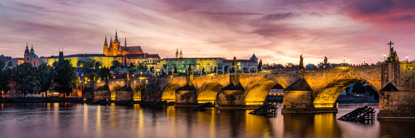 Charles Bridge at sunset with colorful sky, Prague, Czech Republic. Prague old town and iconic Charles bridge and Castle, Czech Republic. Charles Bridge (Karluv Most), Old Town Tower and Castle.