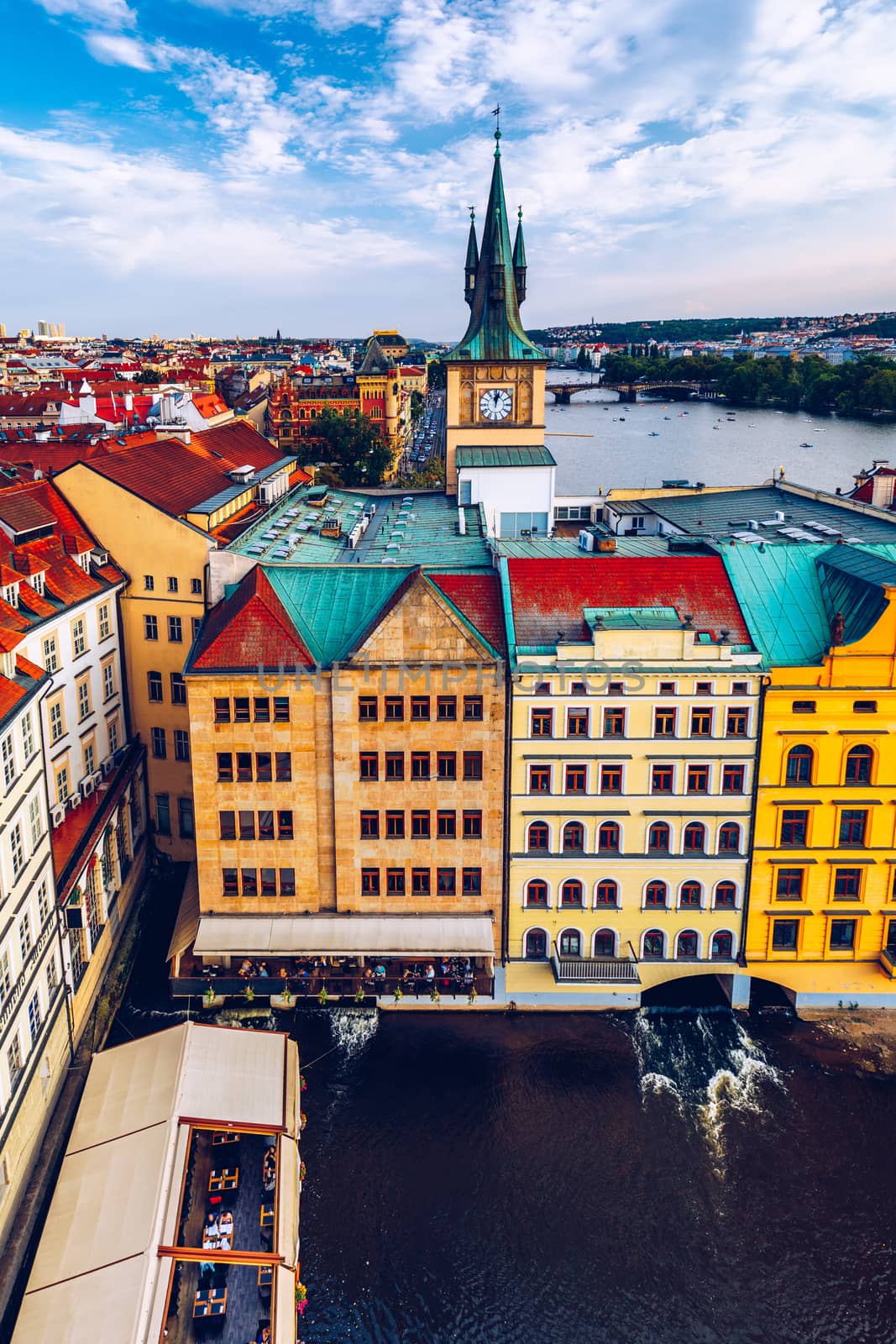 Scenic summer aerial panorama of the Old Town architecture in Prague, Czech Republic. Red roof tiles panorama of Prague old town.  Prague Old Town Square houses with traditional red roofs. Czechia.