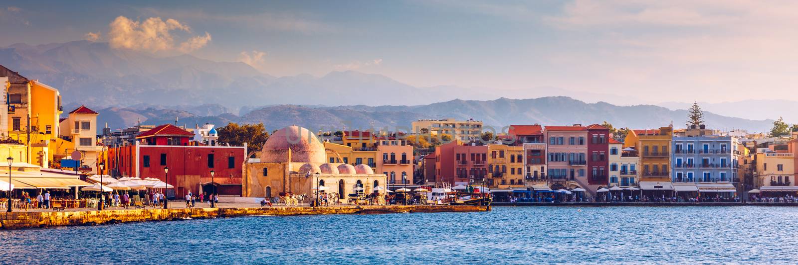 Mosque in the old Venetian harbor of Chania town on Crete island, Greece. Old mosque in Chania. Janissaries or Kioutsouk Hassan Mosque in Chania Crete. Turkish mosque in Chania bay. Crete, Greece.