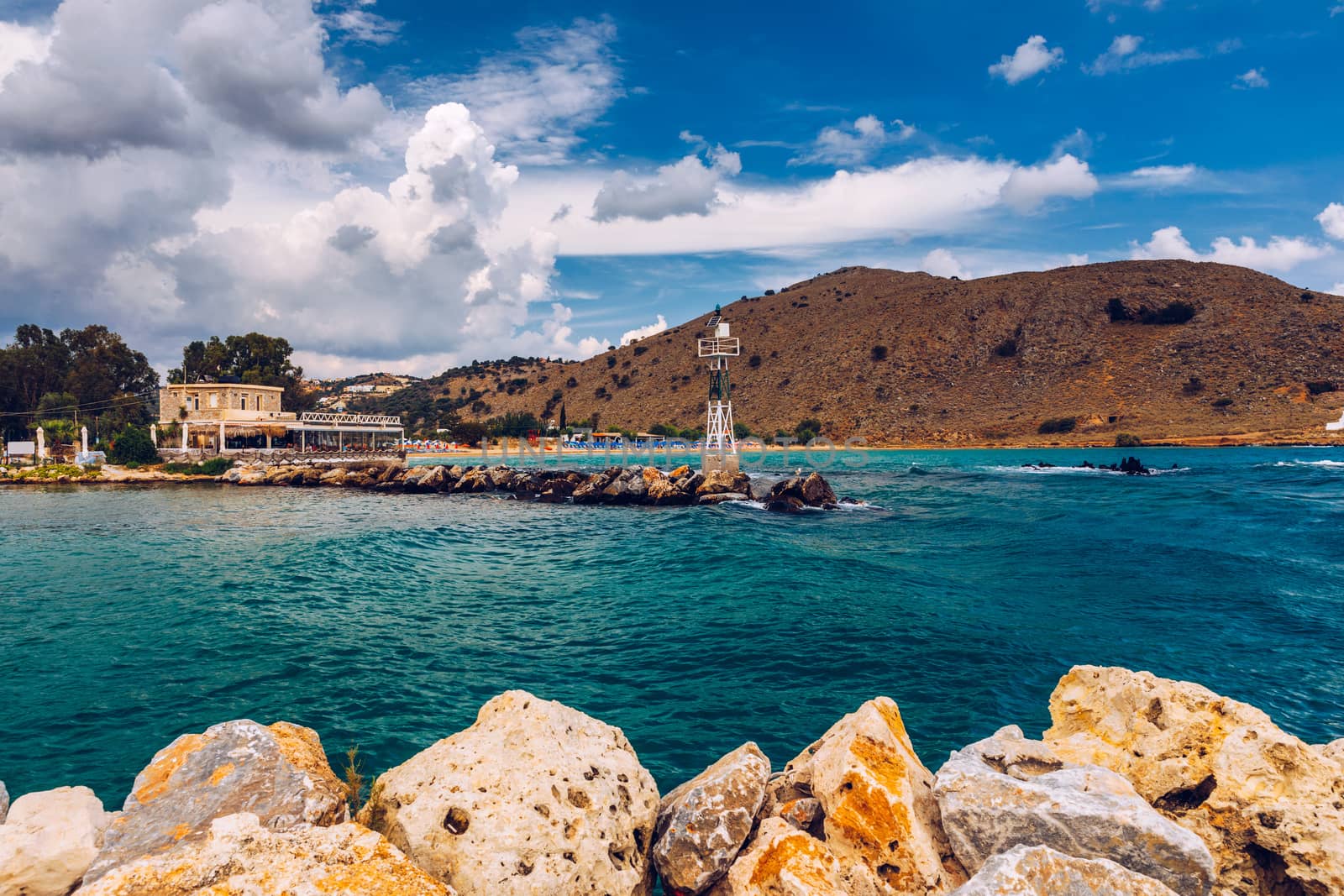 View of sunbeds awaiting tourists at the Greek island resort of Georgioupolis on Crete north coast. Georgioupoli is a resort village and former municipality in the Chania regional unit, Crete, Greece.