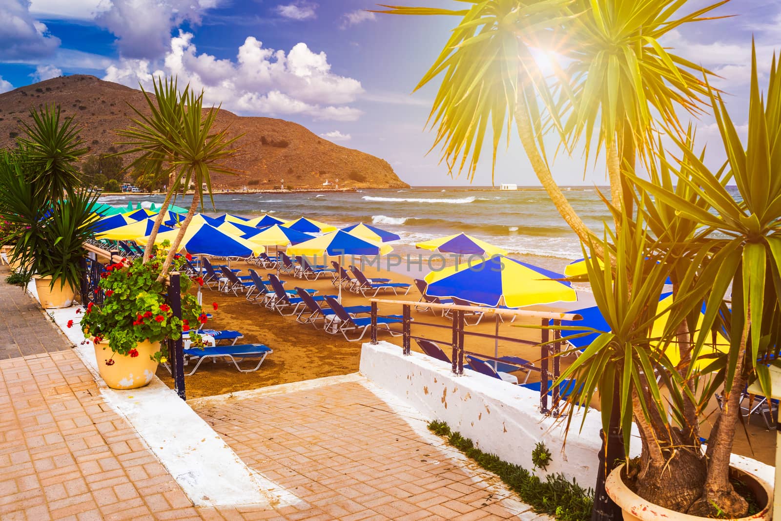 View of sunbeds awaiting tourists at the Greek island resort of Georgioupolis on Crete north coast. Georgioupoli is a resort village and former municipality in the Chania regional unit, Crete, Greece.