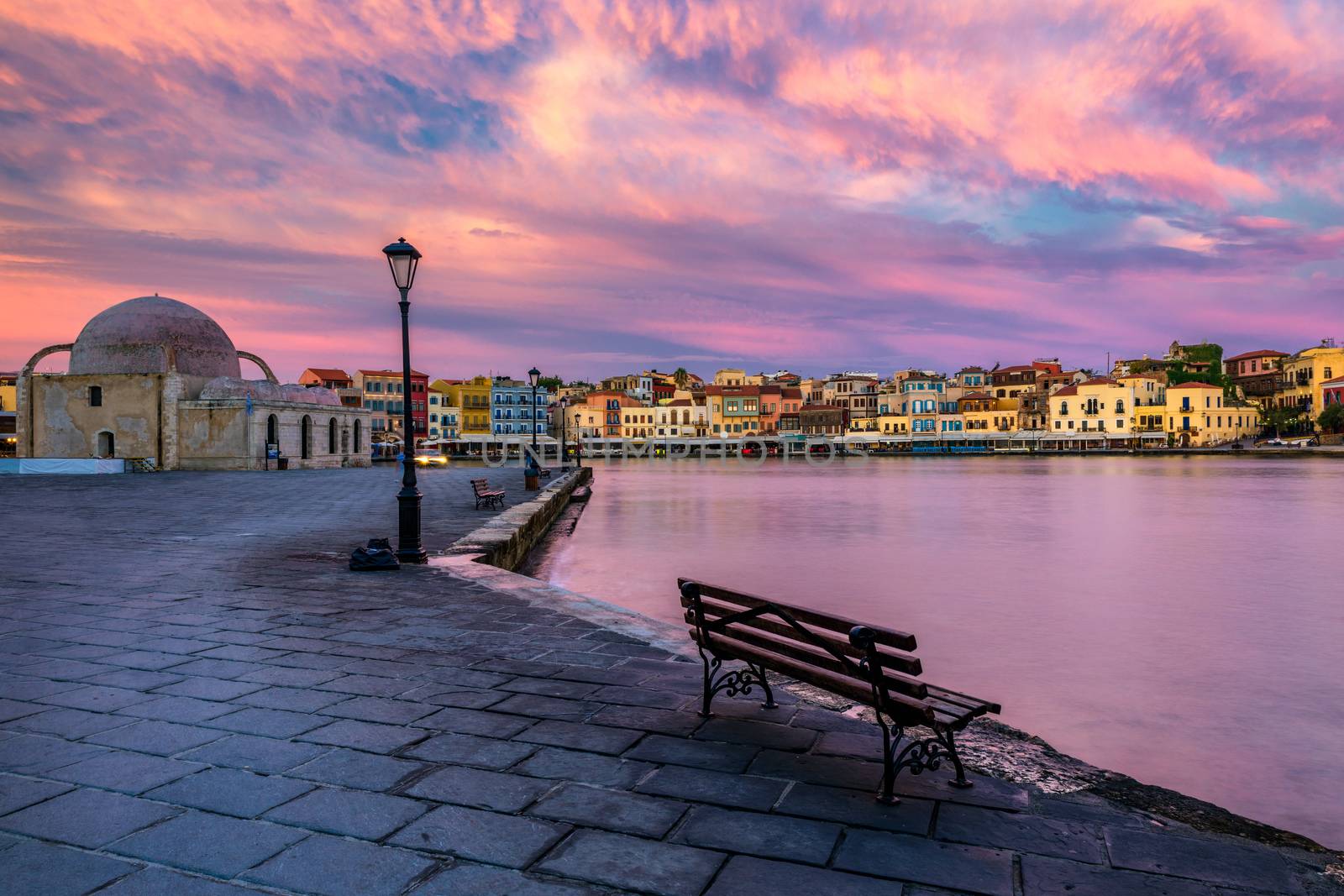 Venetian Harbour of the city of Chania at sunrise with turquoise water, Crete, Greece. View of the old port of Chania on Crete, Greece. Chania, Crete, Greece. View of the old port of Chania on Crete.