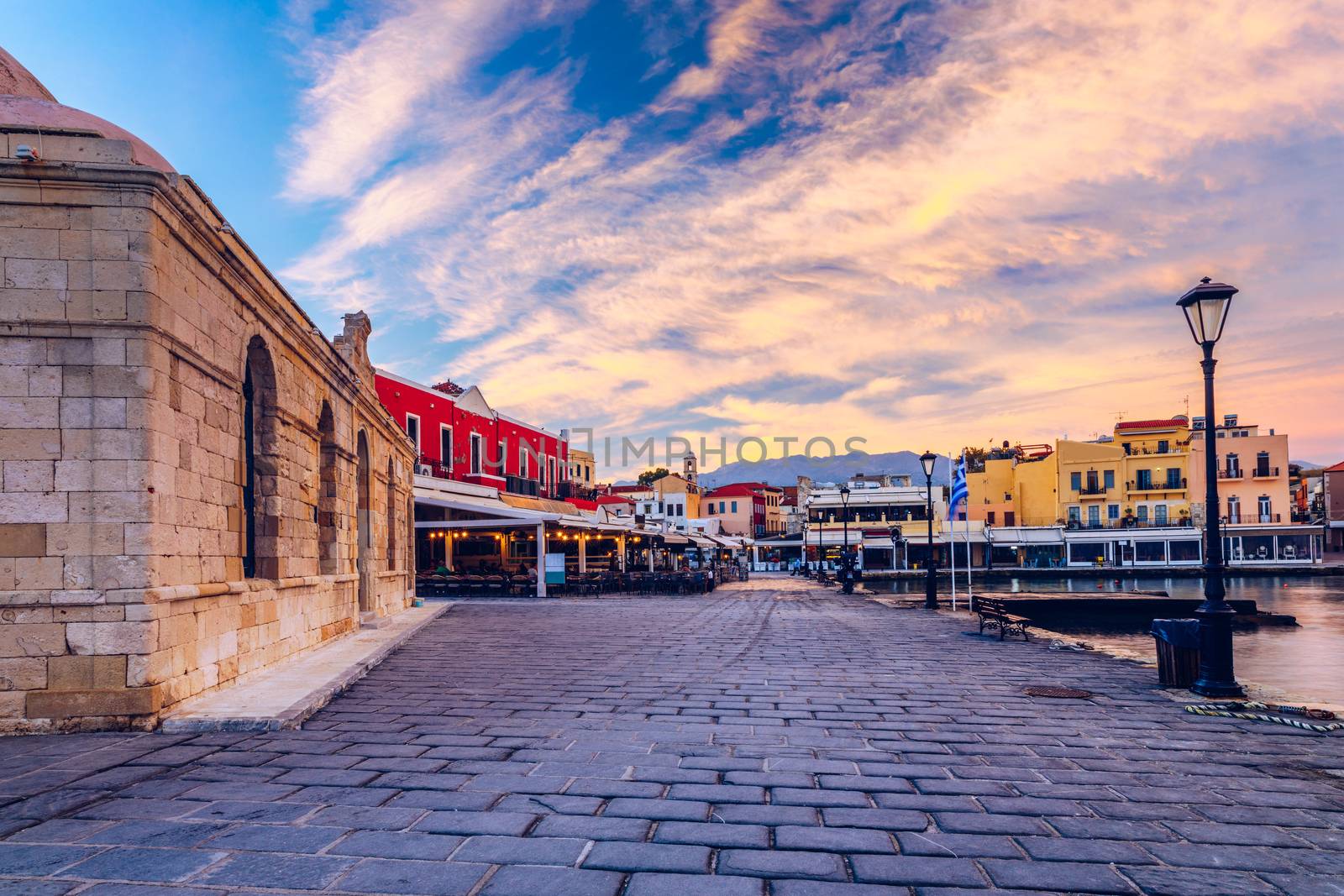 Venetian Harbour of the city of Chania at sunrise with turquoise water, Crete, Greece. View of the old port of Chania on Crete, Greece. Chania, Crete, Greece. View of the old port of Chania on Crete.