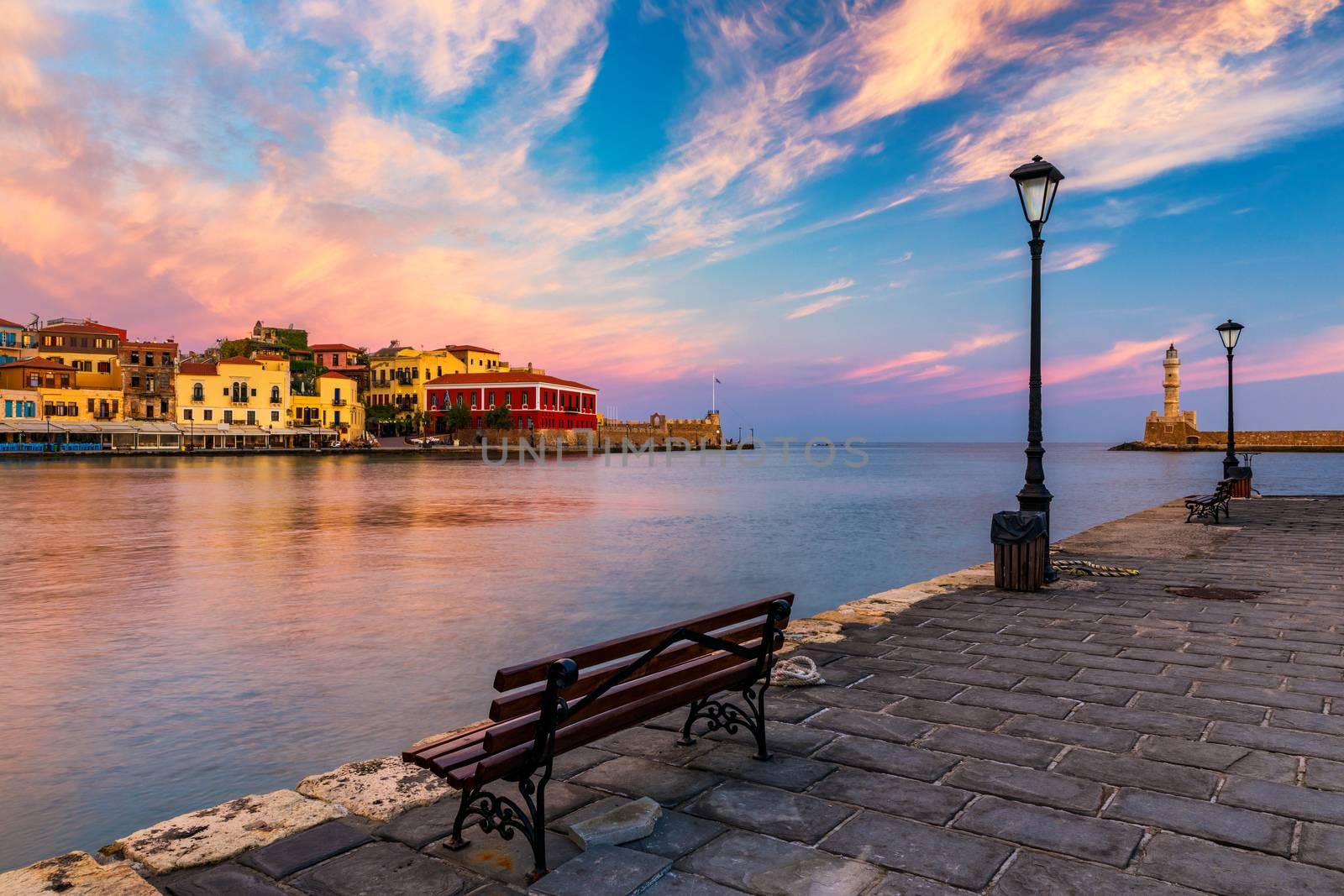 Venetian Harbour of the city of Chania at sunrise with turquoise water, Crete, Greece. View of the old port of Chania on Crete, Greece. Chania, Crete, Greece. View of the old port of Chania on Crete.