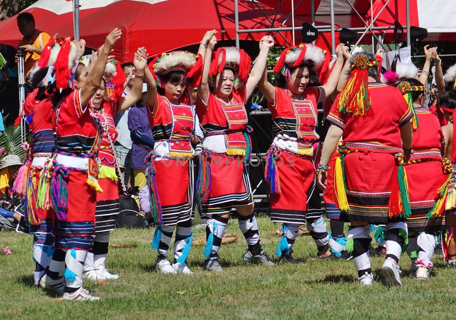 KAOHSIUNG, TAIWAN -- SEPTEMBER 29, 2018: Members of the indigenous Amis tribe in traditional costumes participate in the yearly harvest festival.