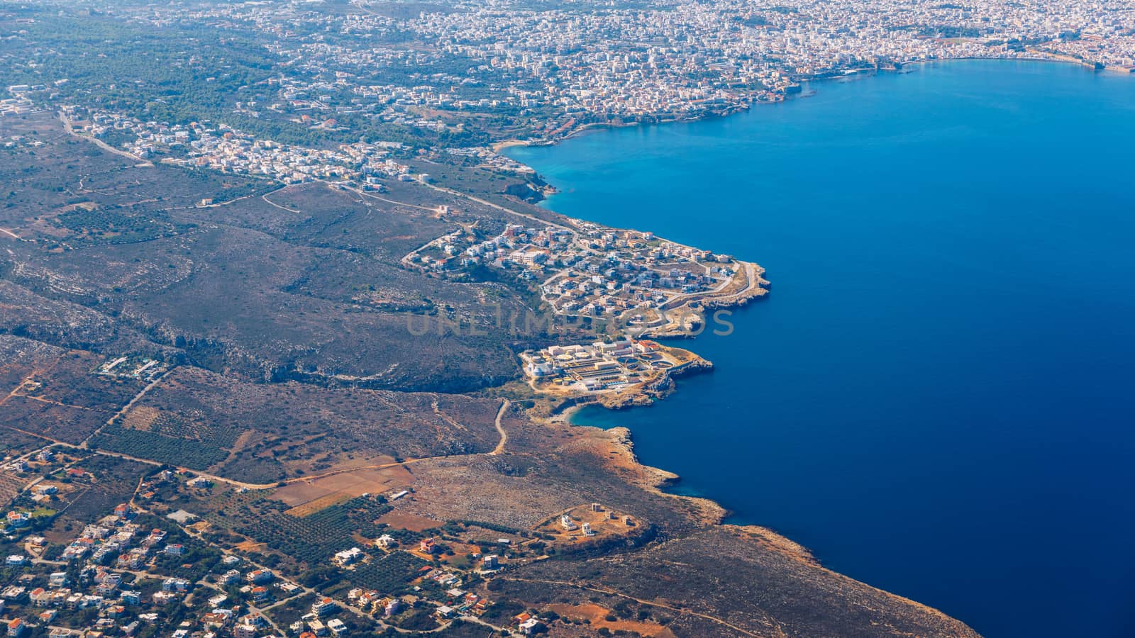 Crete island. Beautiful view of the Crete island Greece from the plane. Holiday, relaxation, sea. Crete view from plane. Greek Island. Seaside of Crete island, aerial view, Greece.