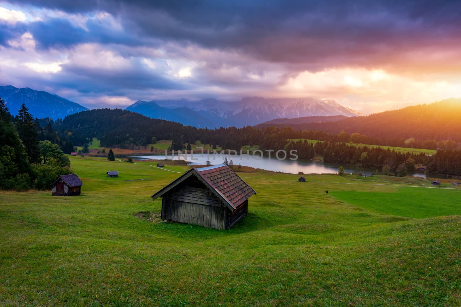 View from flying drone. Astonishing evening view of Wagenbruchsee (Geroldsee) lake with Westliche Karwendelspitze mountain range on background, Bavarian Alps, Germany, Europe.