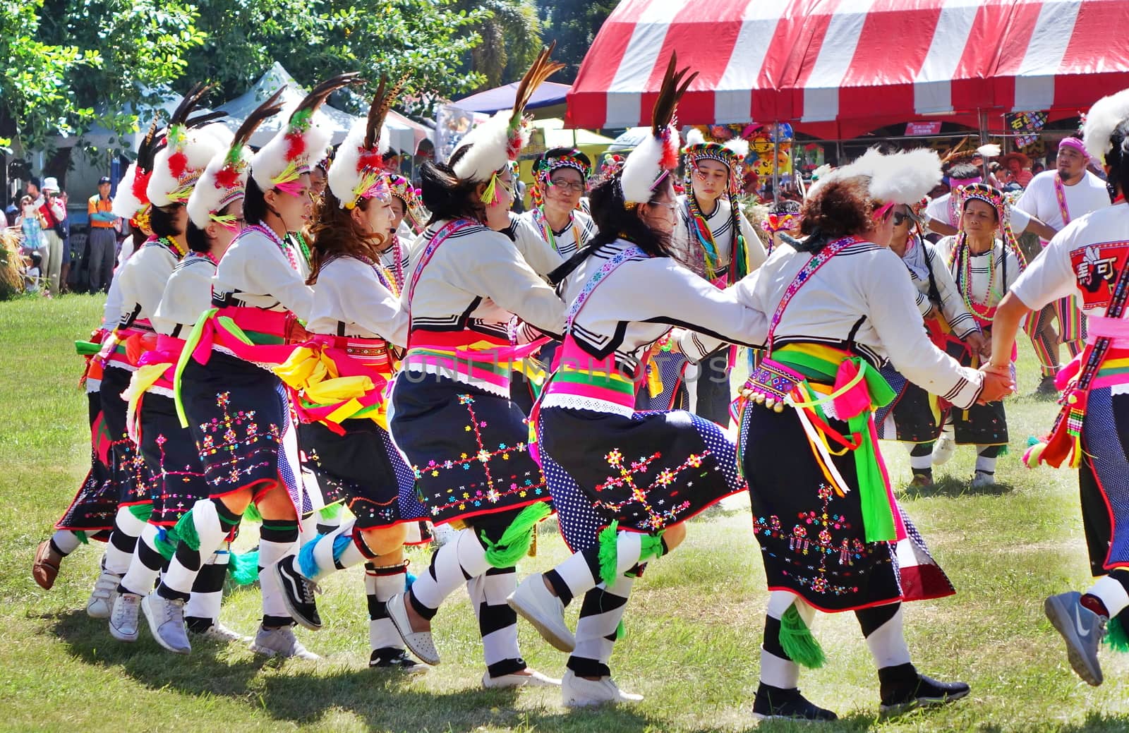 KAOHSIUNG, TAIWAN -- SEPTEMBER 29, 2018: Members of the indigenous Amis tribe in traditional costumes participate in the yearly harvest festival.