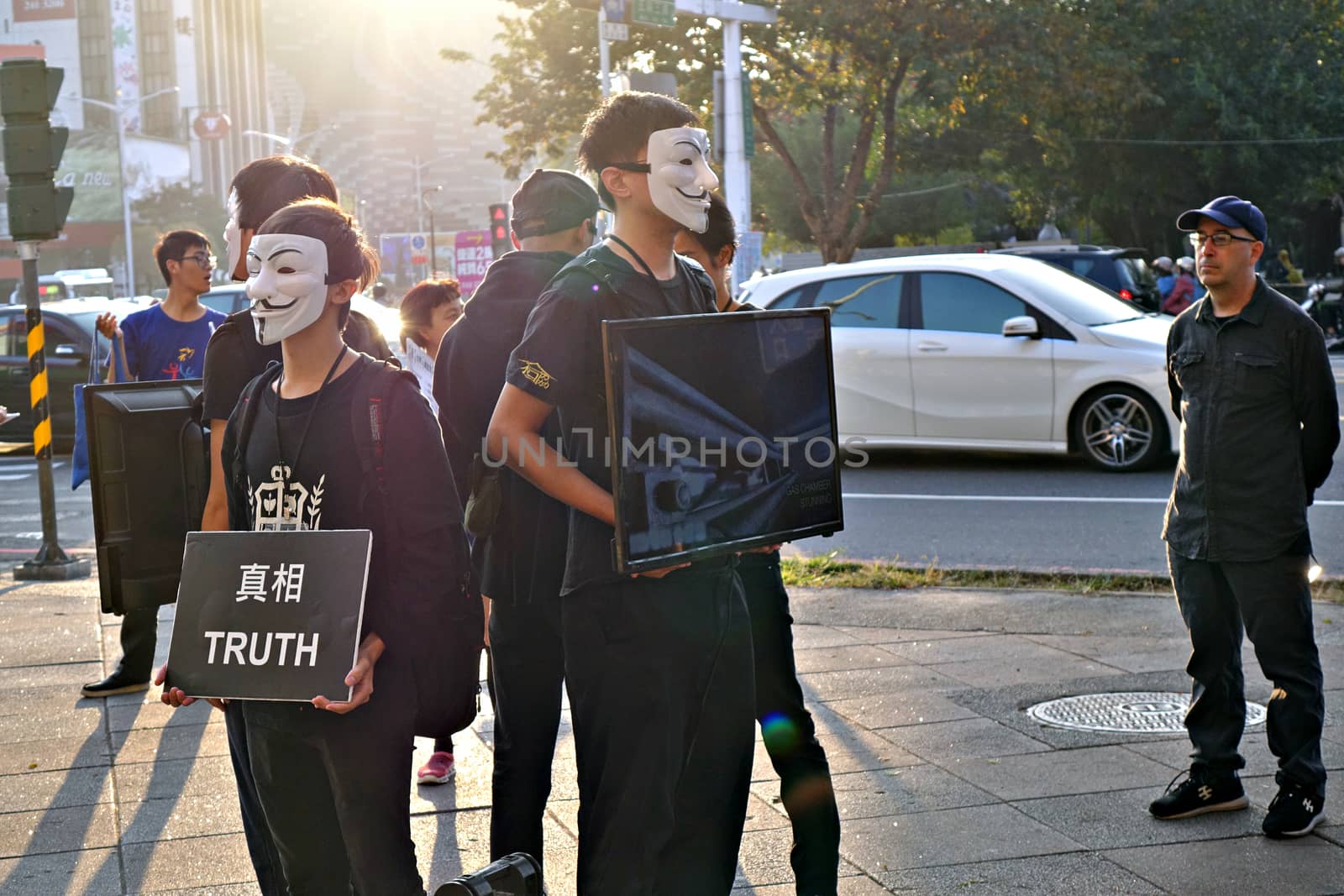 KAOHSIUNG, TAIWAN -- DECEMBER 14, 2019: Demonstrators at a busy intersection in downtown protest against cruelty in the livestock industry.
