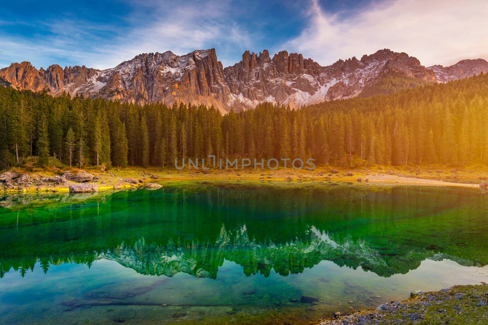 Carezza lake (Lago di Carezza, Karersee) with Mount Latemar, Bolzano province, South tyrol, Italy. Landscape of Lake Carezza or Karersee and Dolomites in background, Nova Levante, Bolzano, Italy.