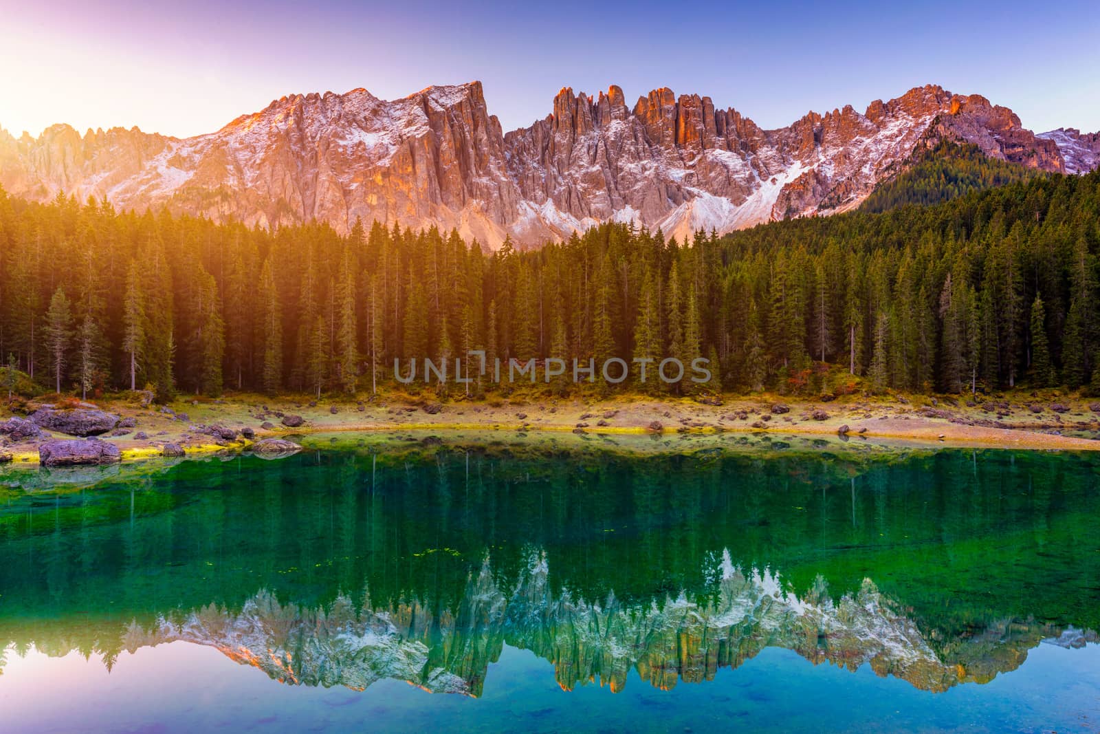 Carezza lake (Lago di Carezza, Karersee) with Mount Latemar, Bolzano province, South tyrol, Italy. Landscape of Lake Carezza or Karersee and Dolomites in background, Nova Levante, Bolzano, Italy.