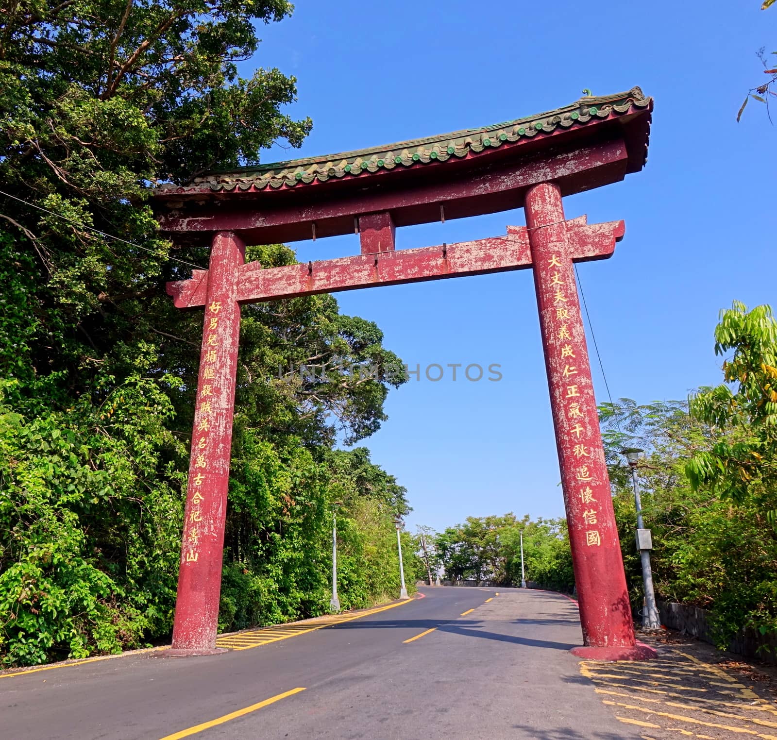 KAOHSIUNG, TAIWAN -- APRIL 29, 2017: A traditional memorial arch in mixed Chinese and Japanese architecture marks the road leading up to the Martyrs' Shrine on Shoushan Mountain.