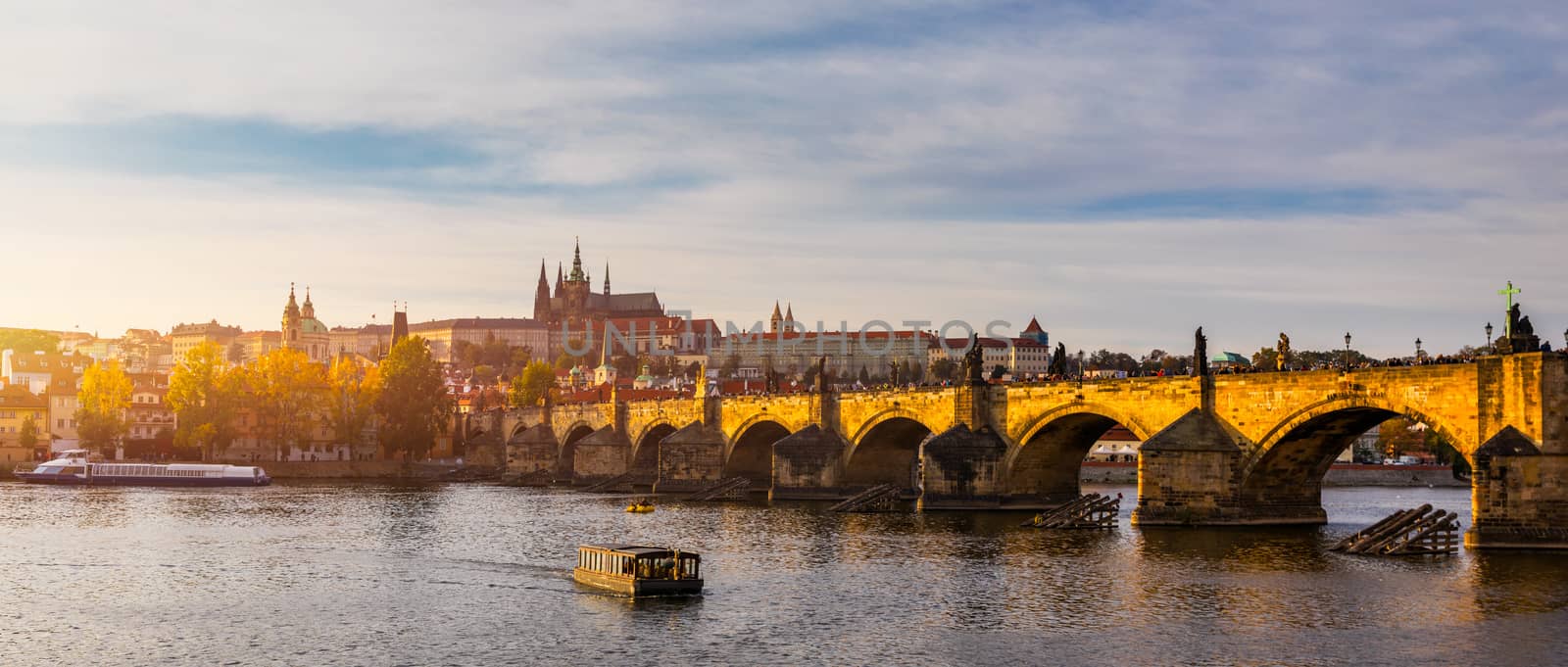 Charles Bridge in Prague in Czechia. Prague, Czech Republic. Charles Bridge (Karluv Most) and Old Town Tower. Vltava River and Charles Bridge. Concept of world travel, sightseeing and tourism.