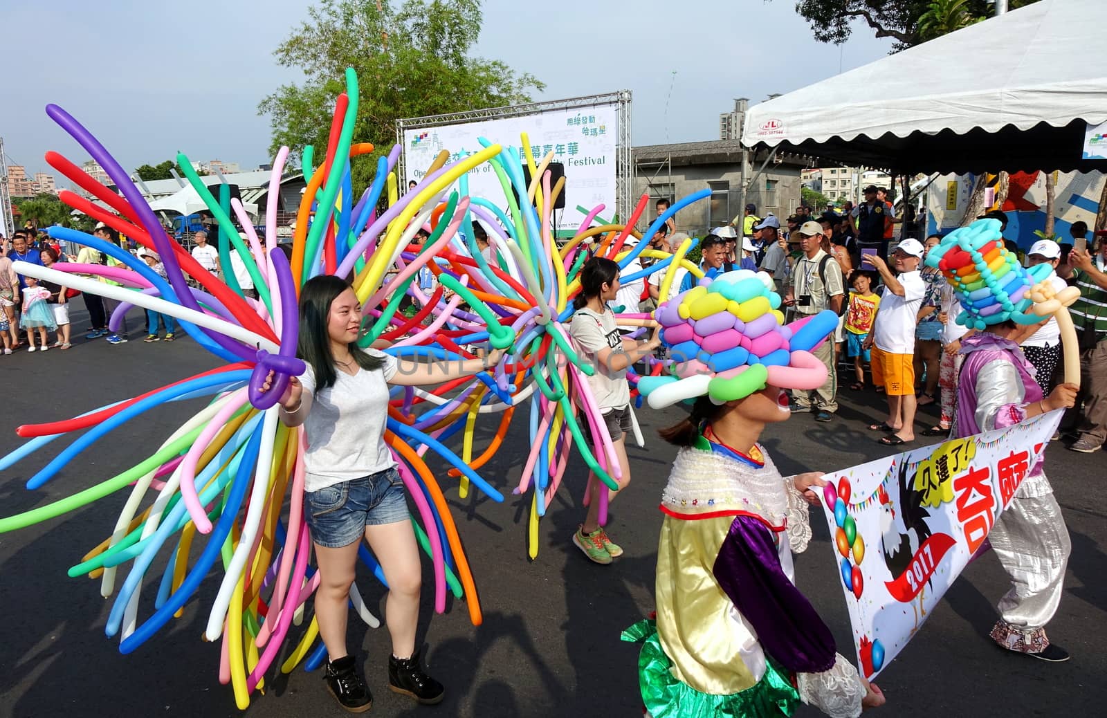KAOHSIUNG, TAIWAN -- OCTOBER 1, 2017: Balloon artists take part in a street parade at the opening of the 2017 Ecomobility Festival.