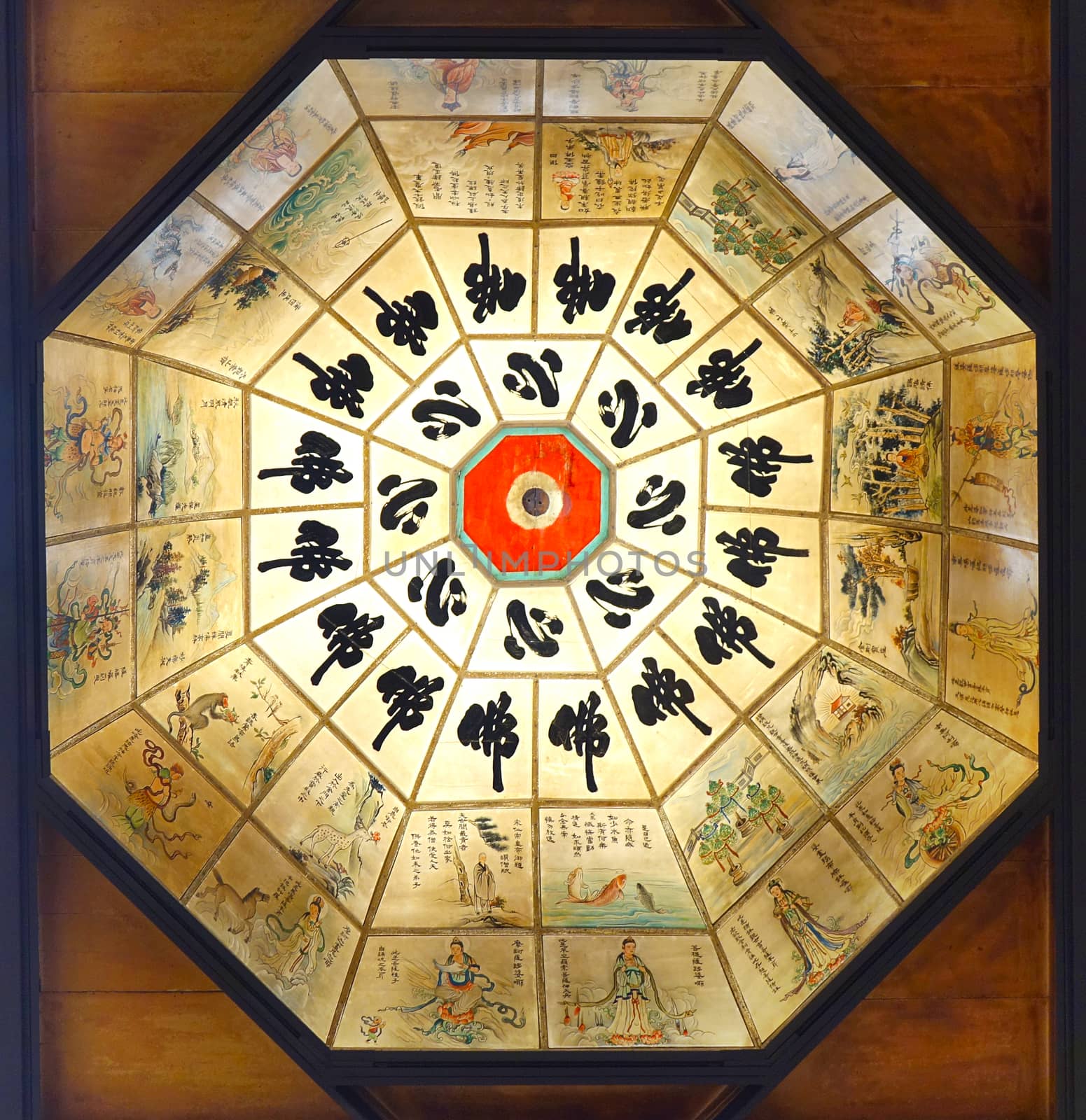 KAOHSIUNG, TAIWAN -- JANUARY 25, 2020: An octagon ceiling light with illustrations of Buddhist scriptures at the Fo Guang Shan Buddhist complex. The Chinese says "Heart of Buddha"
