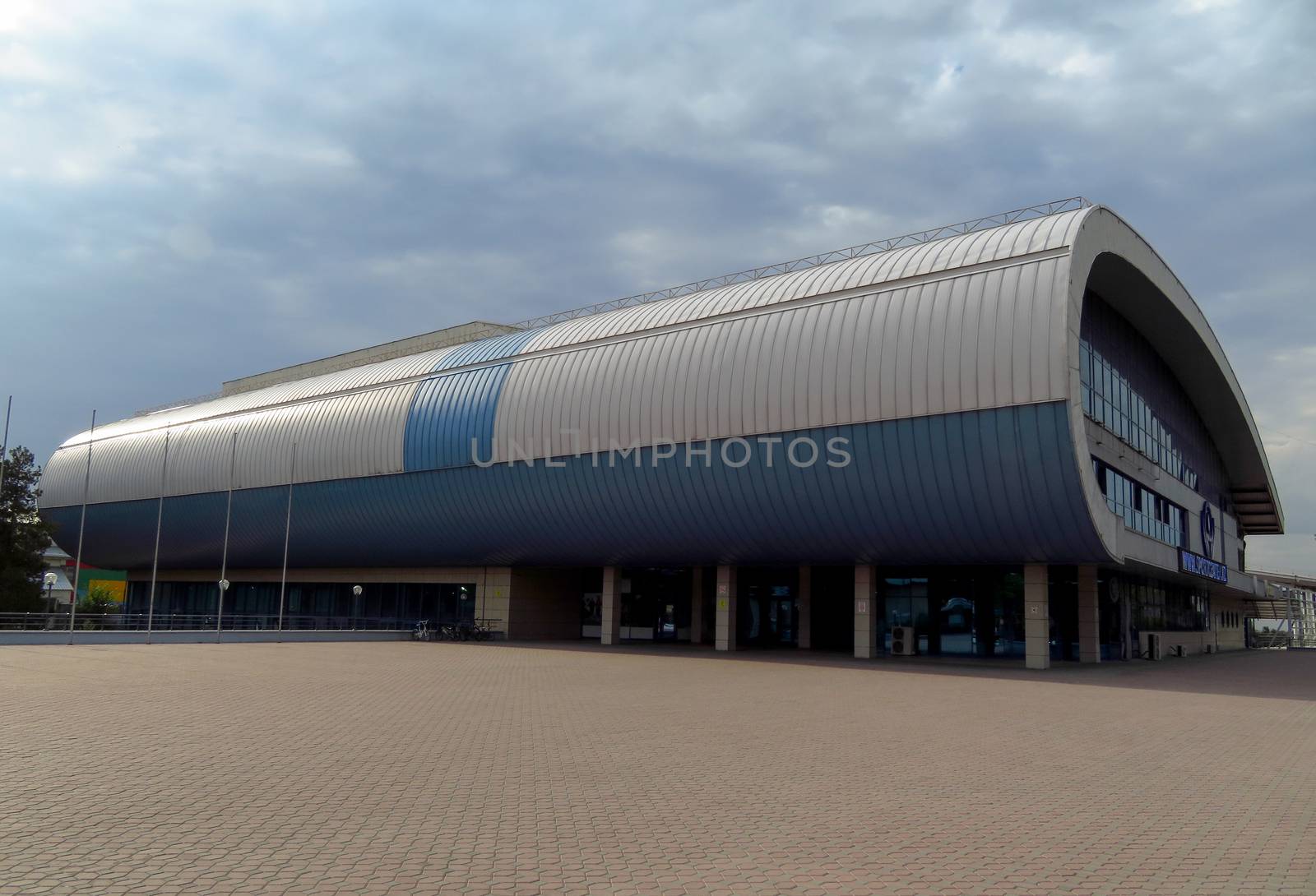 Almaty, Kazakhstan - August 14, 2019: Sports and training complex with a large swimming pool, football field and basketball court. Located at the intersection of Abay and Rozybakiev streets.