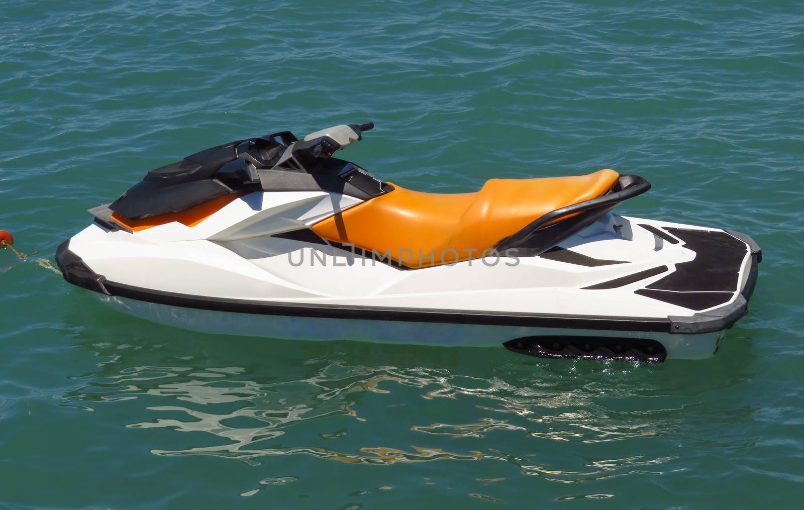 Anchored water scooter at a sea beach