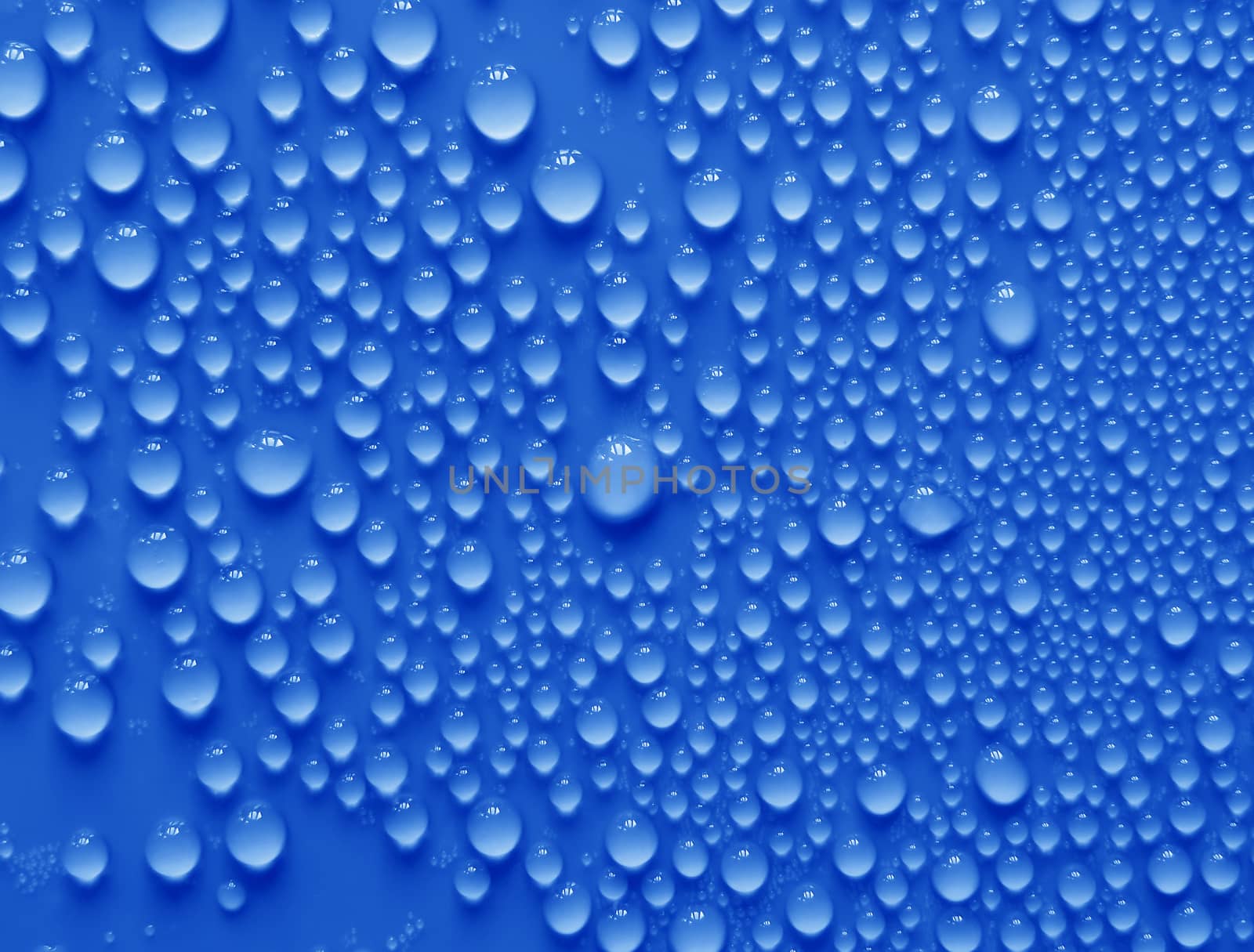 Water drops texture on blue background