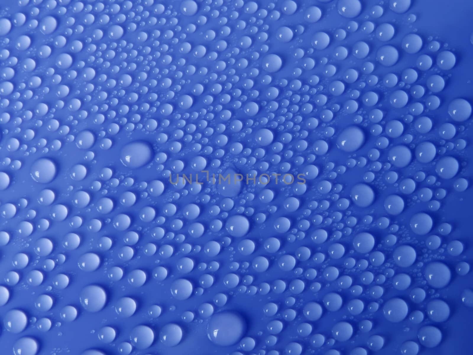 Water drops texture on blue background