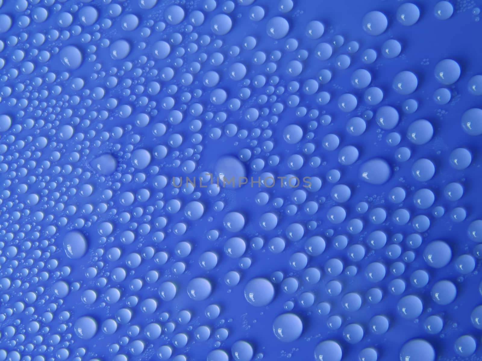 Water drops texture on blue background