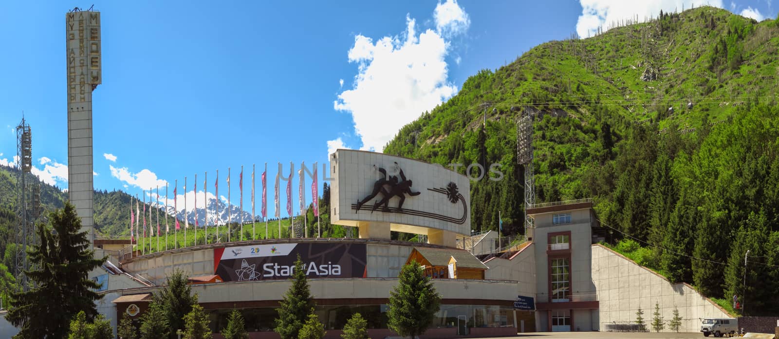 Almaty, Kazakhstan - June 13, 2018: The famous skating rink Medeo and mountains at the background in Almaty, Kazakhstan