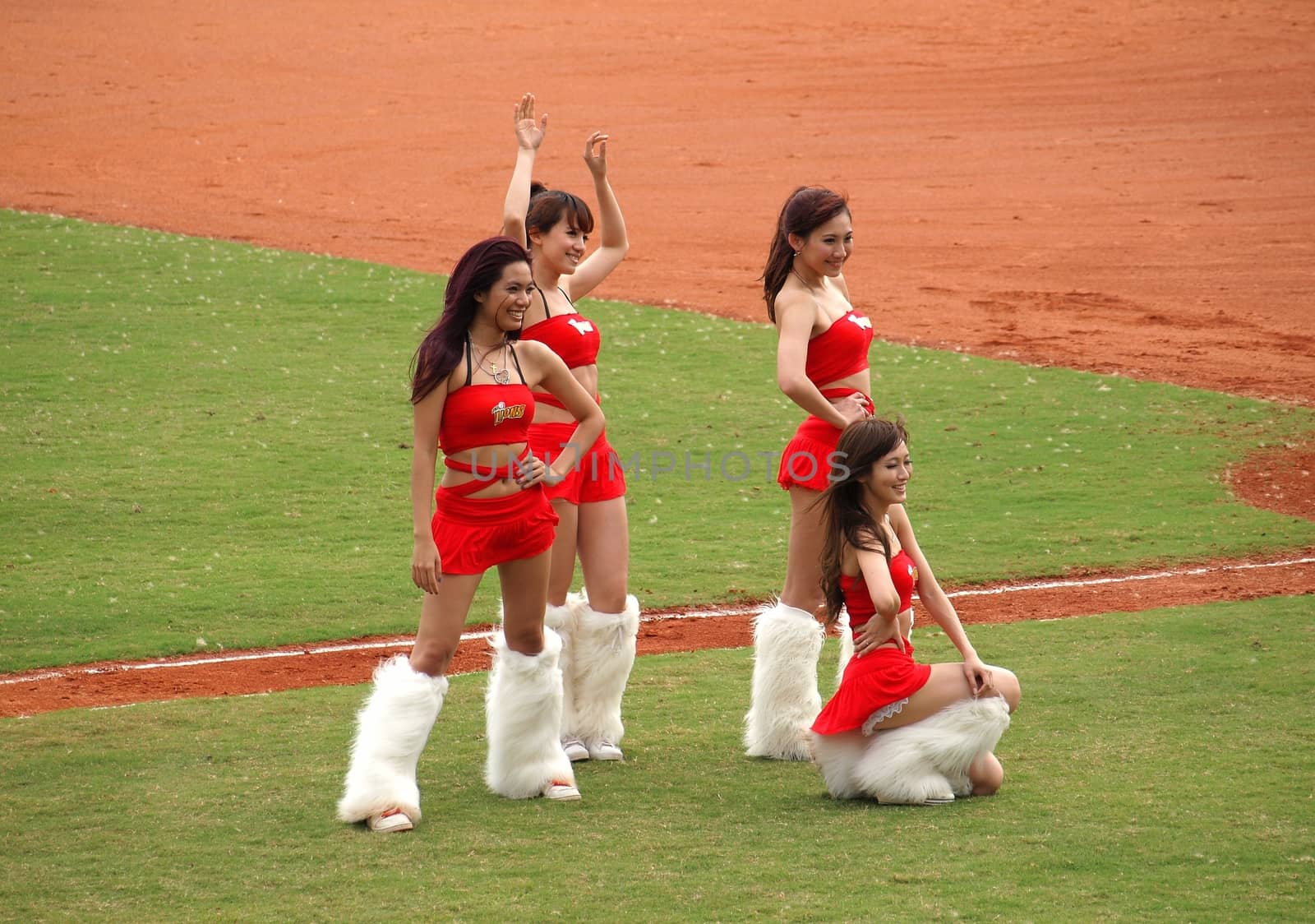 PINGTUNG, TAIWAN, APRIL 8: Cheerleaders encourage the fans of  the President Lions who face the Lamigo Monkeys in a Pro Baseball League game. The Lions won 2:0 on April 8, 2012 in Pingtung. 
