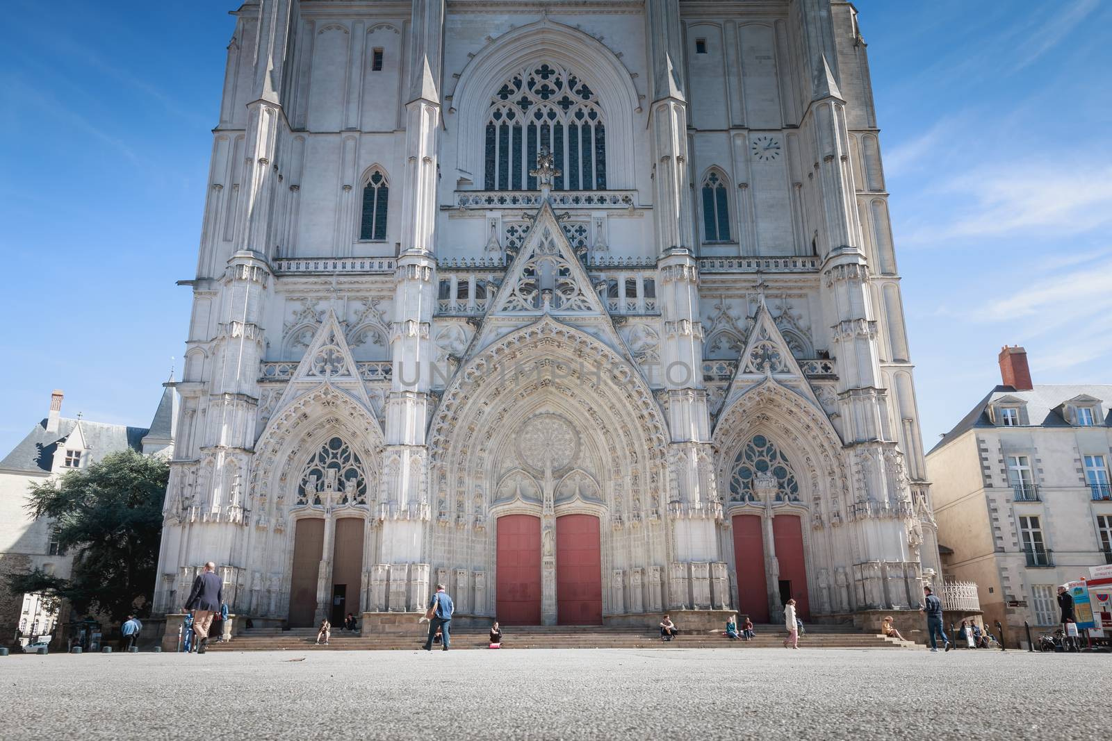 Nantes, France - September 29, 2018: parvis of Saint Pierre cathedral in Nantes where people walk on a summer day...