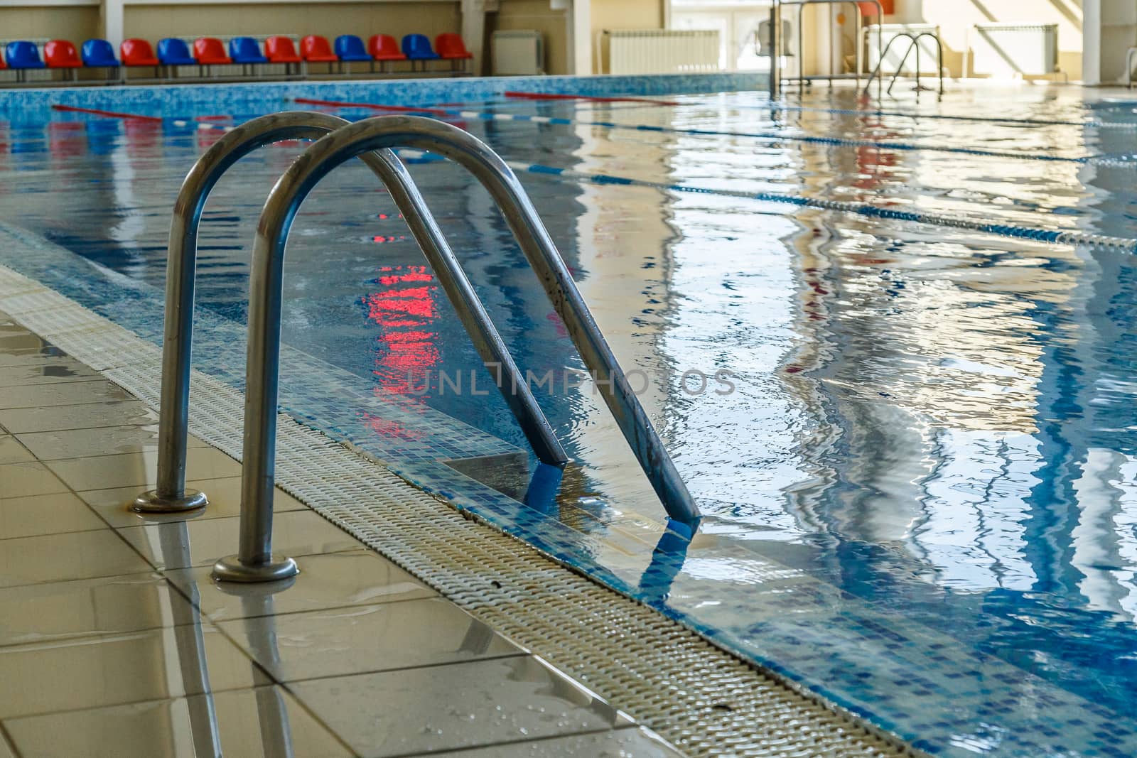 metal ladder for launching into the water in the pool