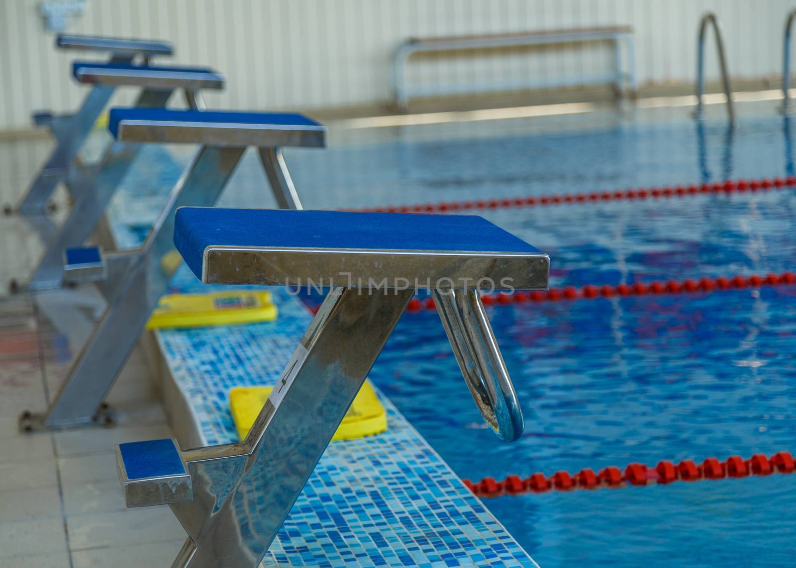 stone for jumping in the pool, selective focus by VADIM