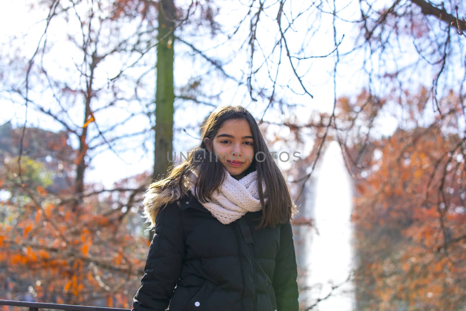 Beautiful girl in the park during the fall.