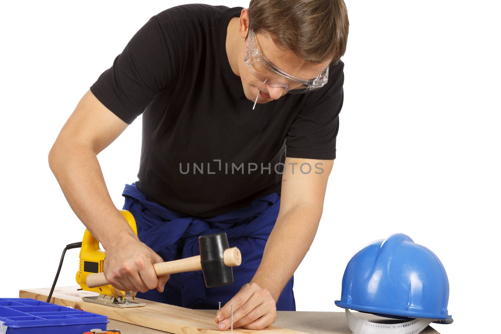 Man working with tools and wood. Over white.