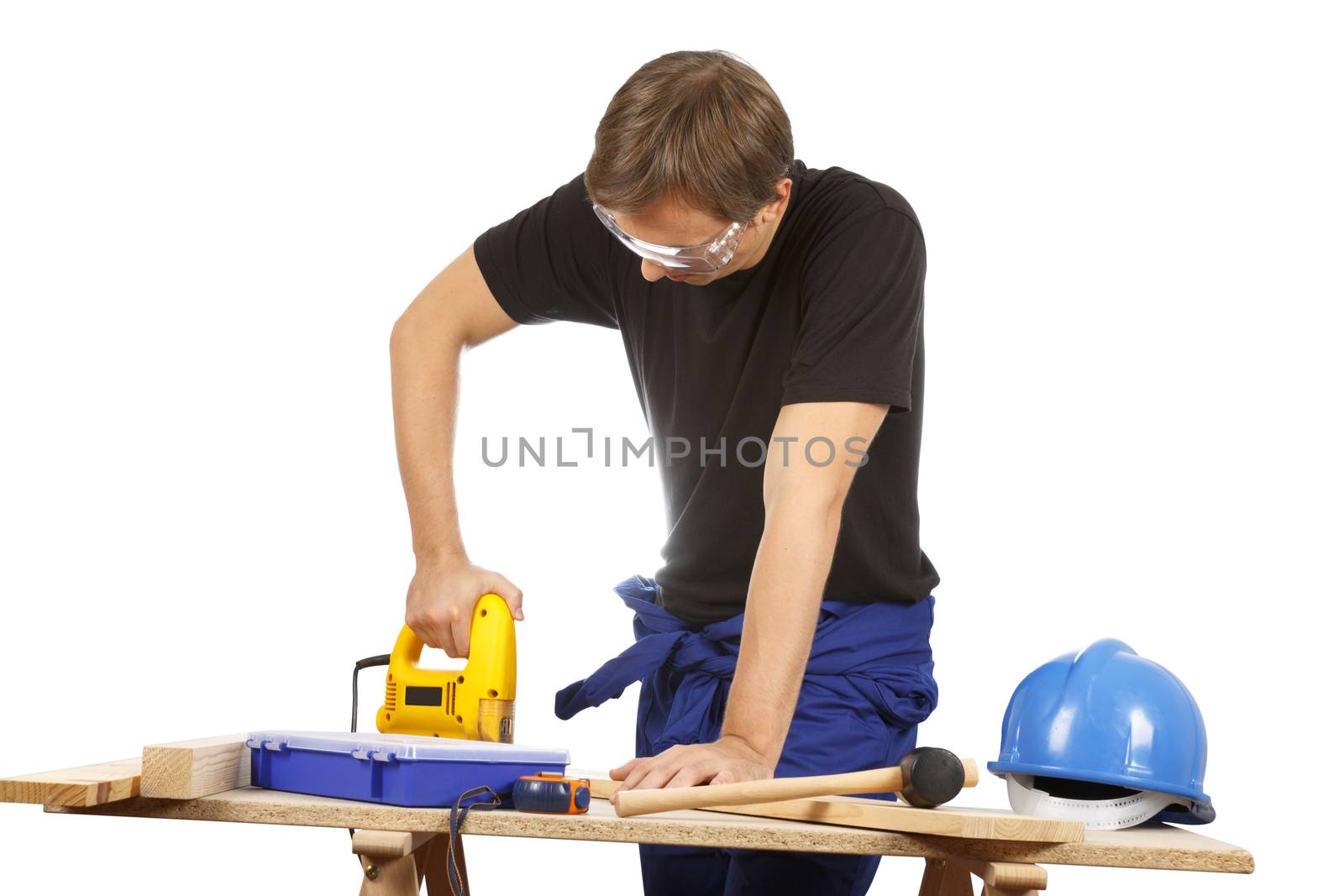 Man working with tools and wood. Over white.