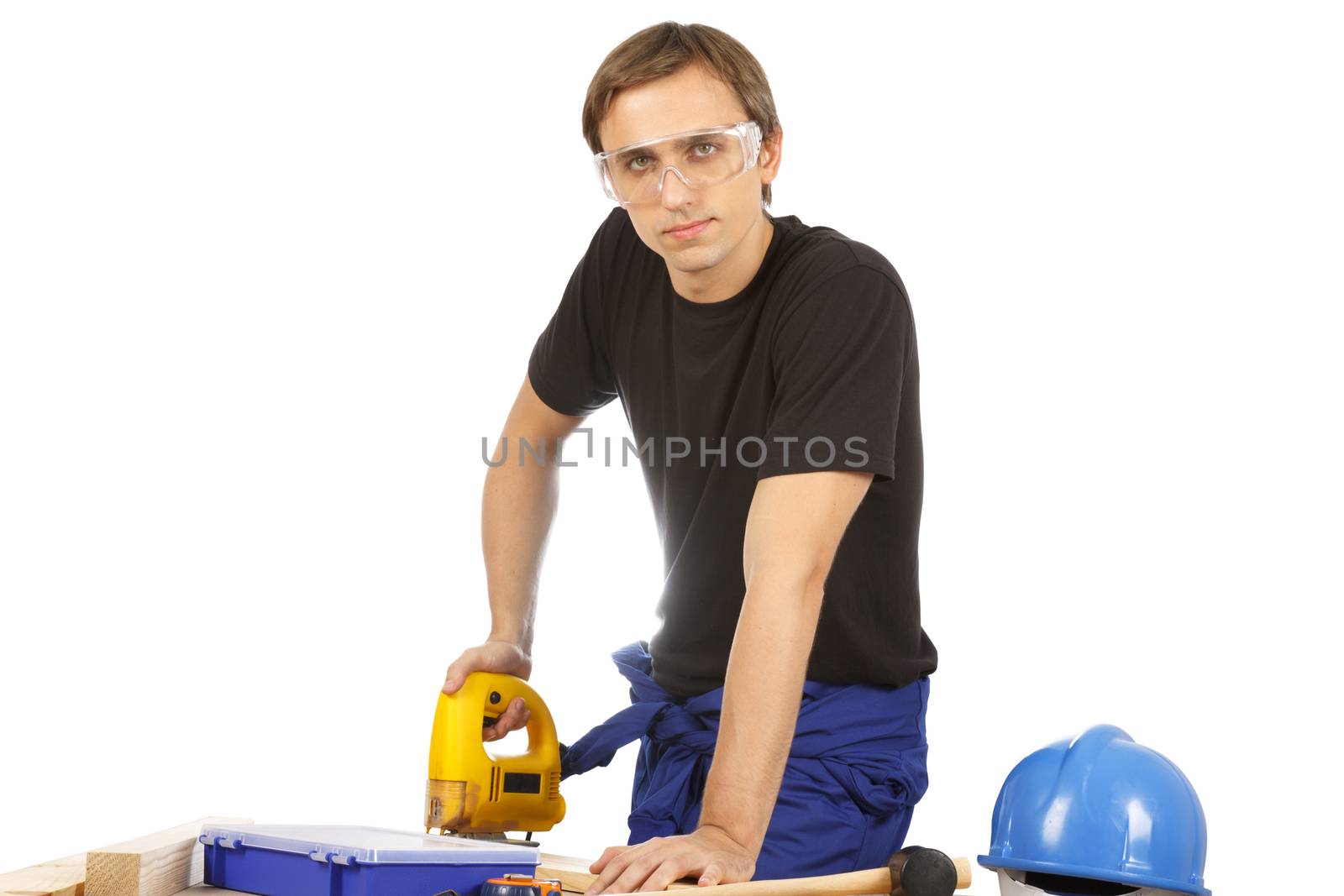 Man working with tools and wood. Over white.