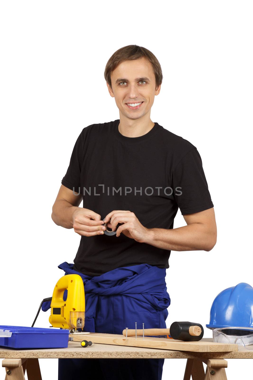 Man working with tools and wood. Over white.