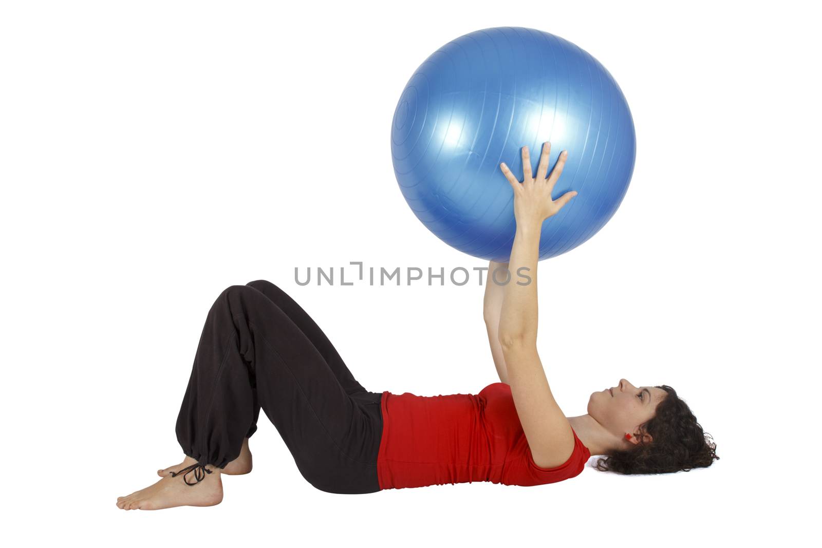 Young woman holding a blue yoga ball.