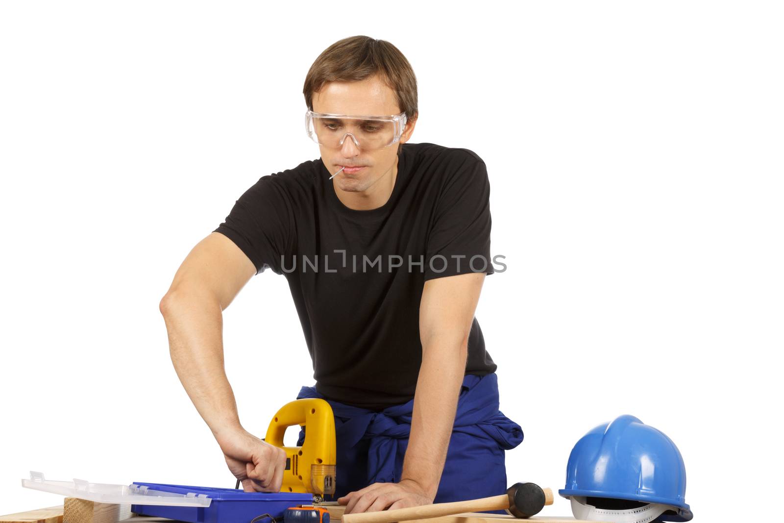 Man working with tools and wood. Over white.