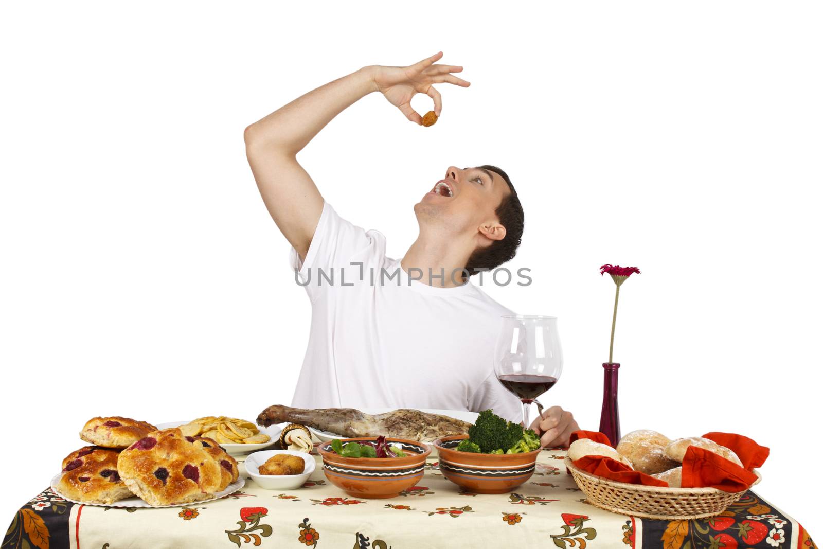 Young man eating croquettes. Isolated of white background.