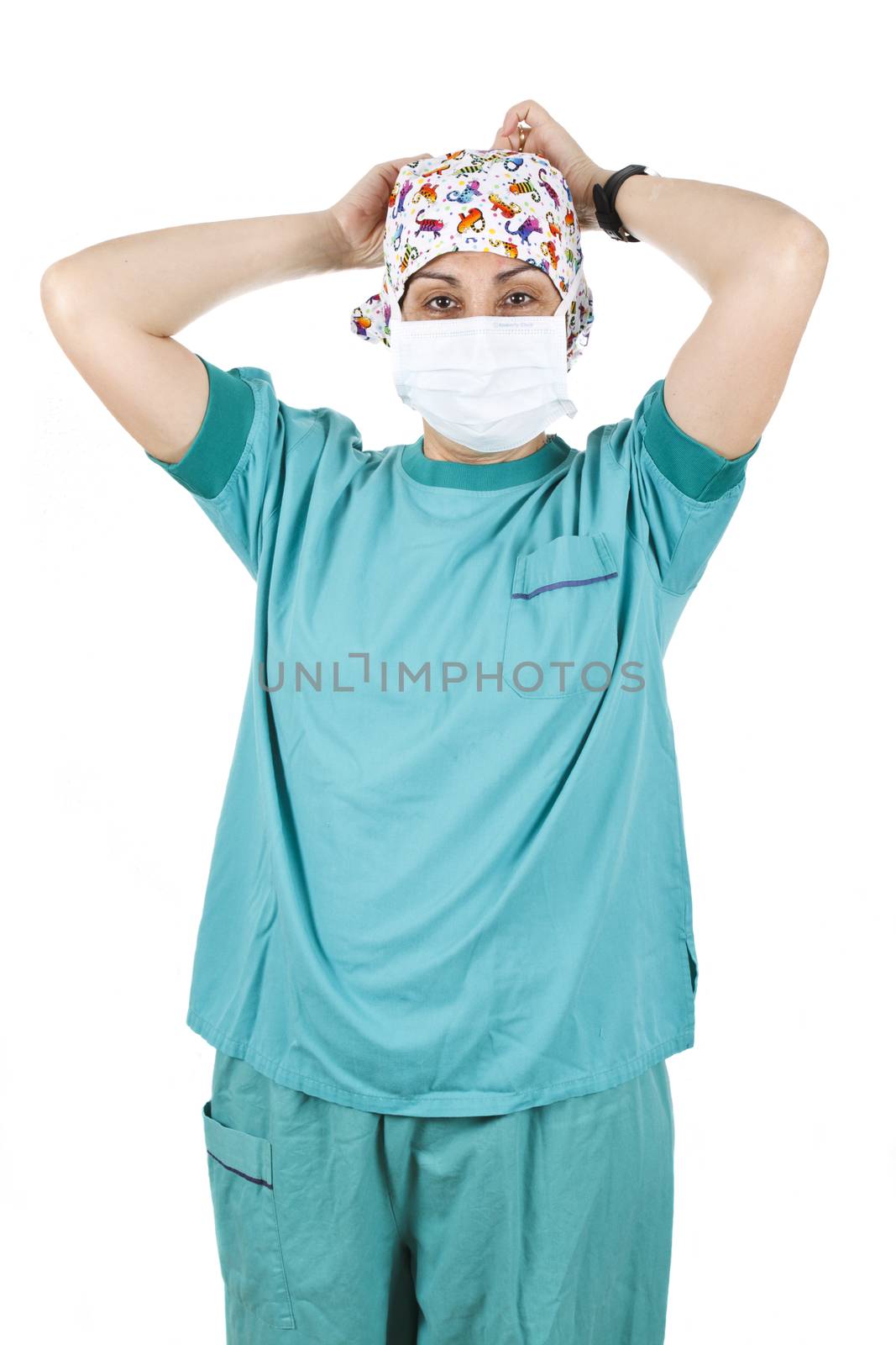 Female nurse putting on her mask, isolated on white background.