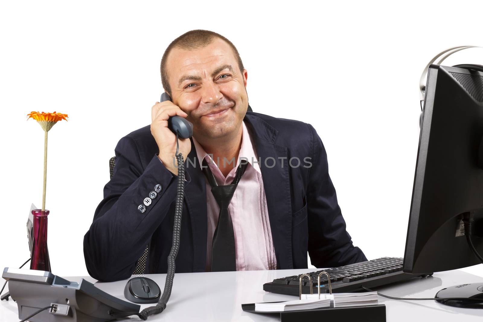 Businessman smiling with a phone. Over white.