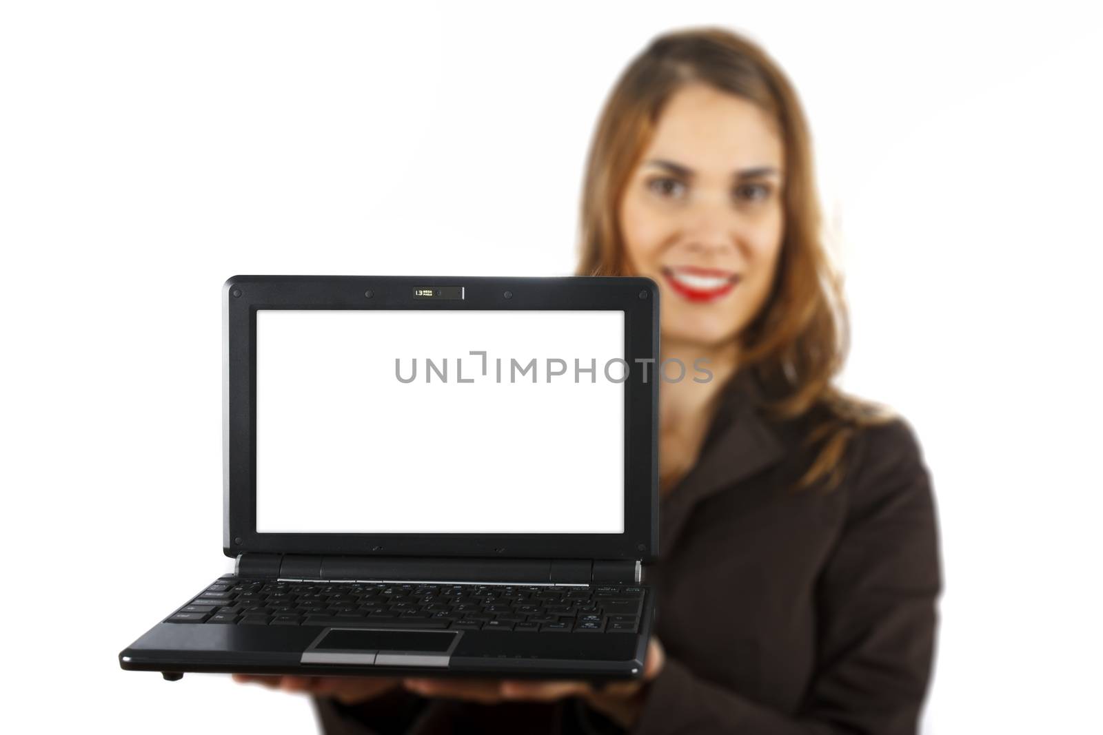 Businesswoman out of focus at background showing a laptop with white display. Isolated on white background.