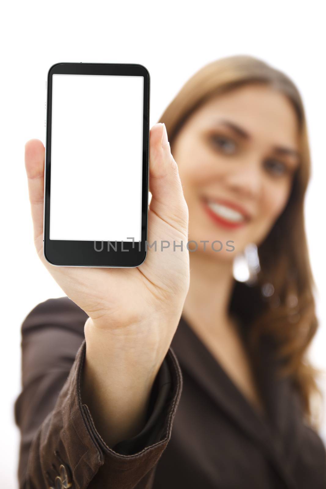 Businesswoman out of focus at background showing a mobile phone with white display. Isolated on white background.
