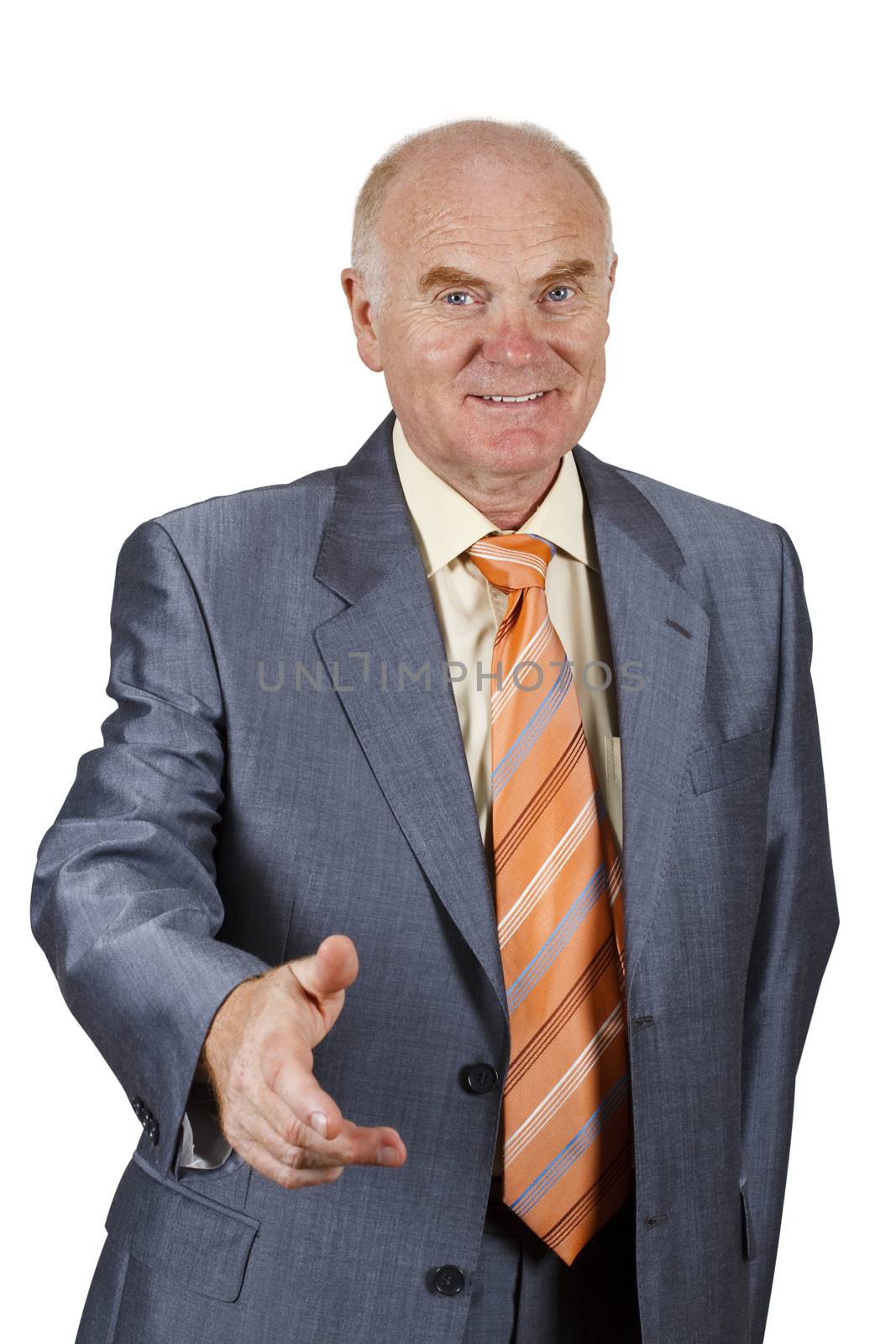 A senior businessman offering for handshake.