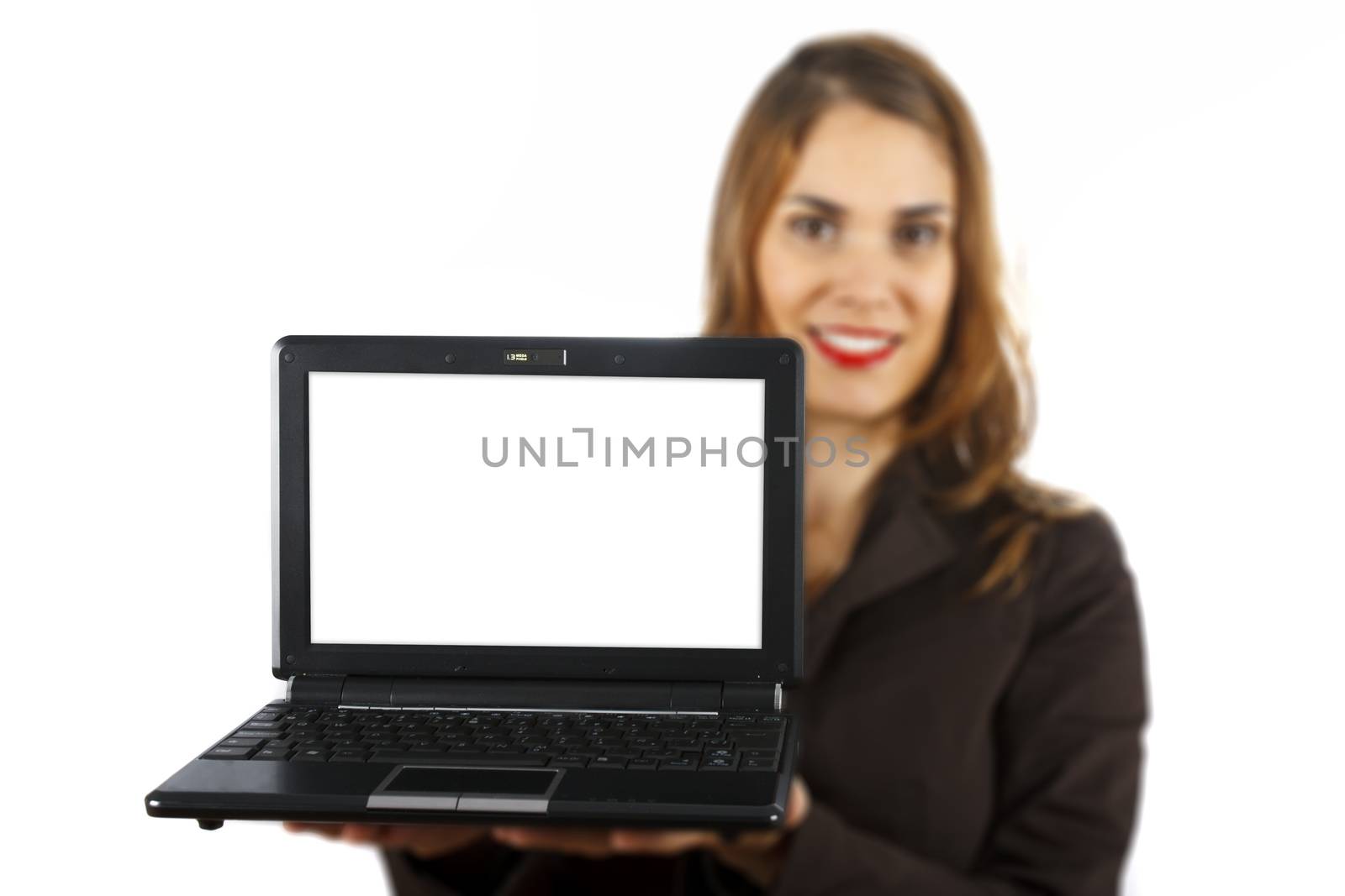 Businesswoman out of focus at background showing a laptop with white display. Isolated on white background.