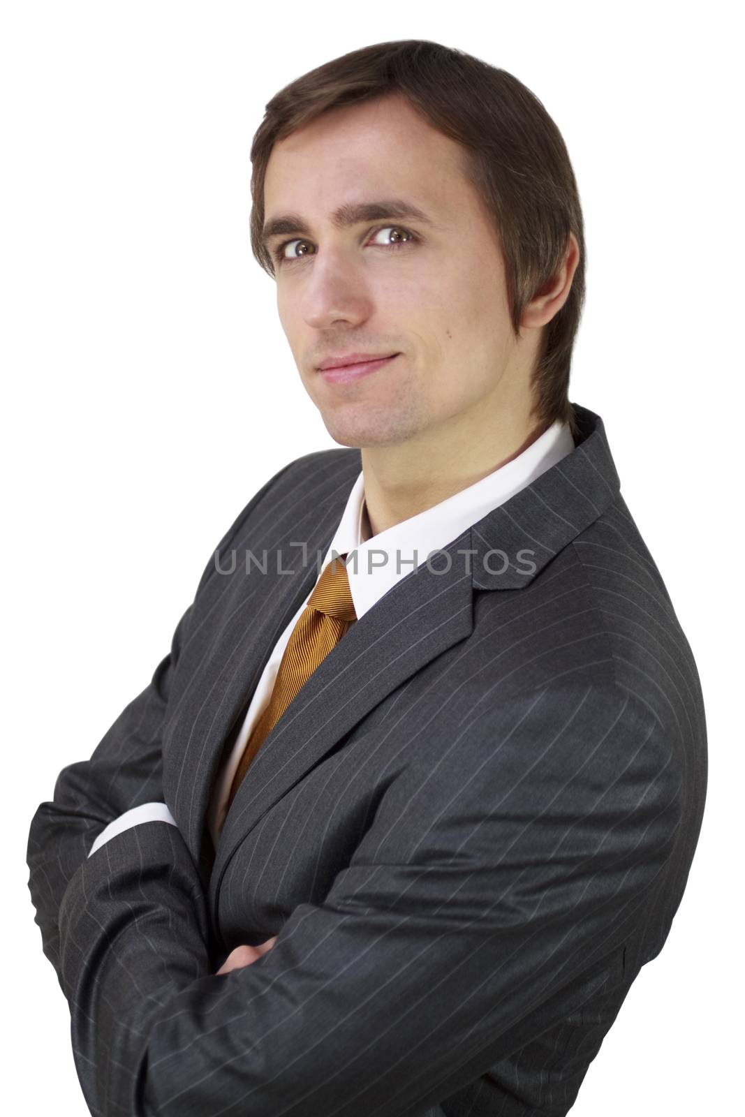 A confident young businessman isolated on white background.