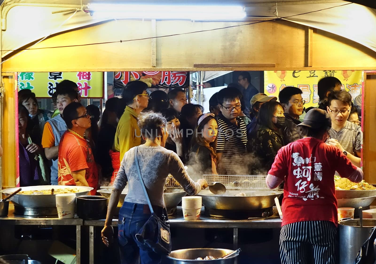 KAOHSIUNG, TAIWAN -- FEBRUARY 9, 2019: Large crowds of people visit the many food stalls during the Lantern Festival.
