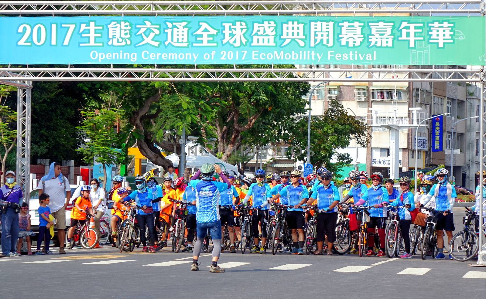 KAOHSIUNG, TAIWAN -- OCTOBER 1, 2017: A large team of cyclists prepares to take part in a street parade at the opening of the 2017 Ecomobility Festival.
