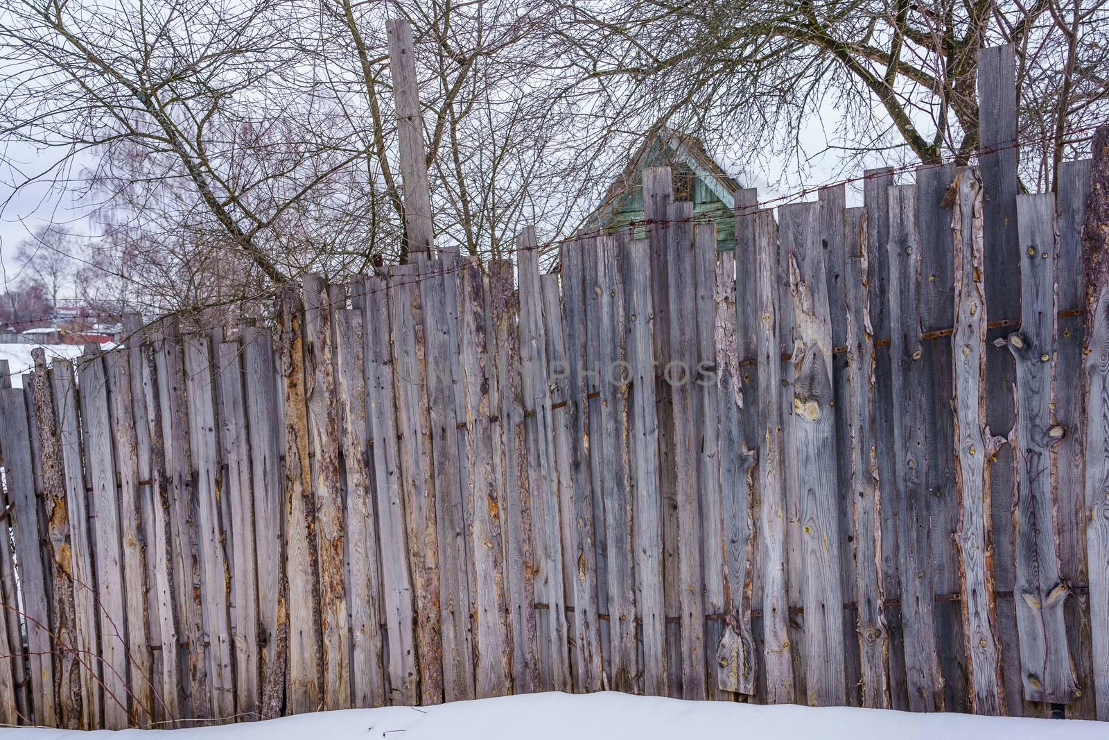 fence around the garden of nailing boards by VADIM