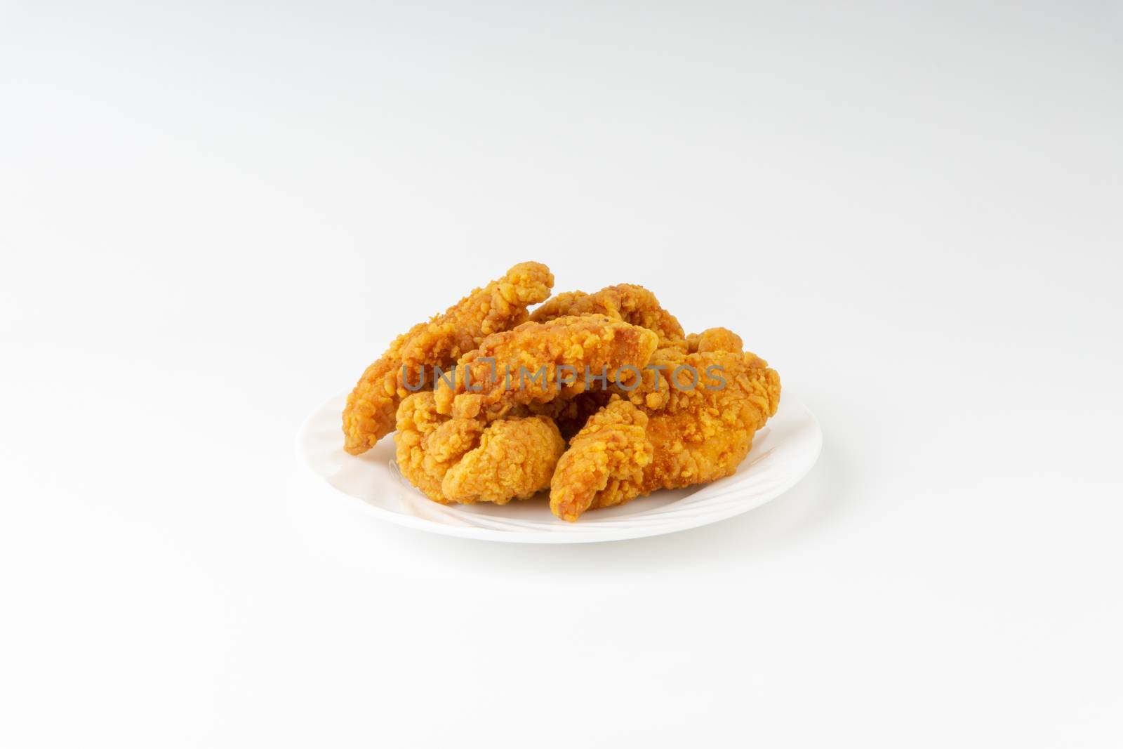 Fried breaded chicken fillet isolated on white background  by silverwings