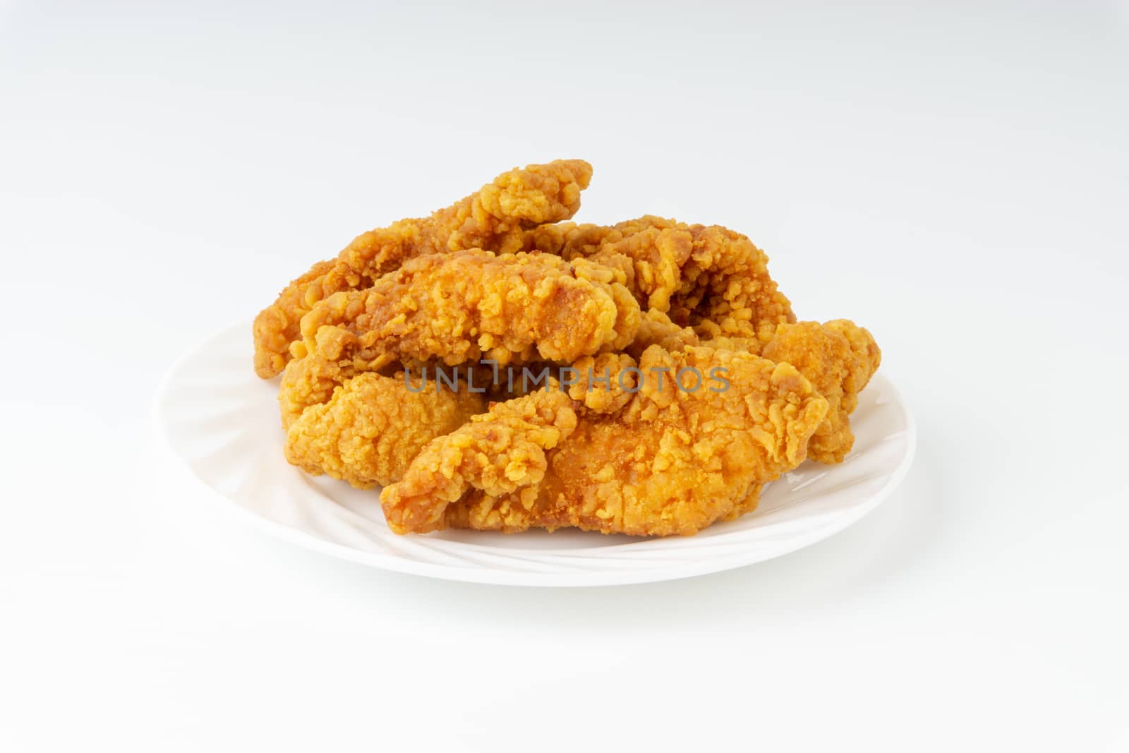 Fried breaded chicken fillet isolated on white background  by silverwings